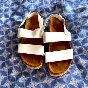 White wedge platform sandals.